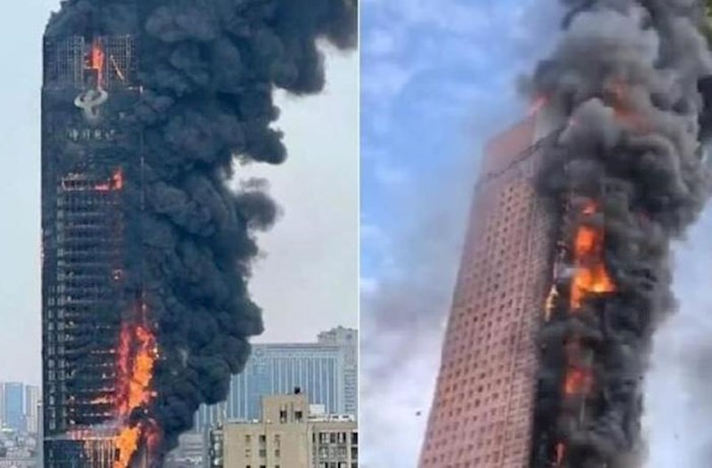 Huge fire breaks out in high rise building in China - Video